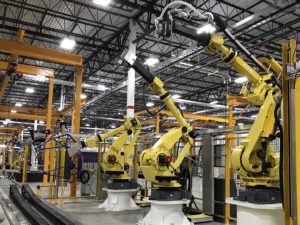 Robots welding metal